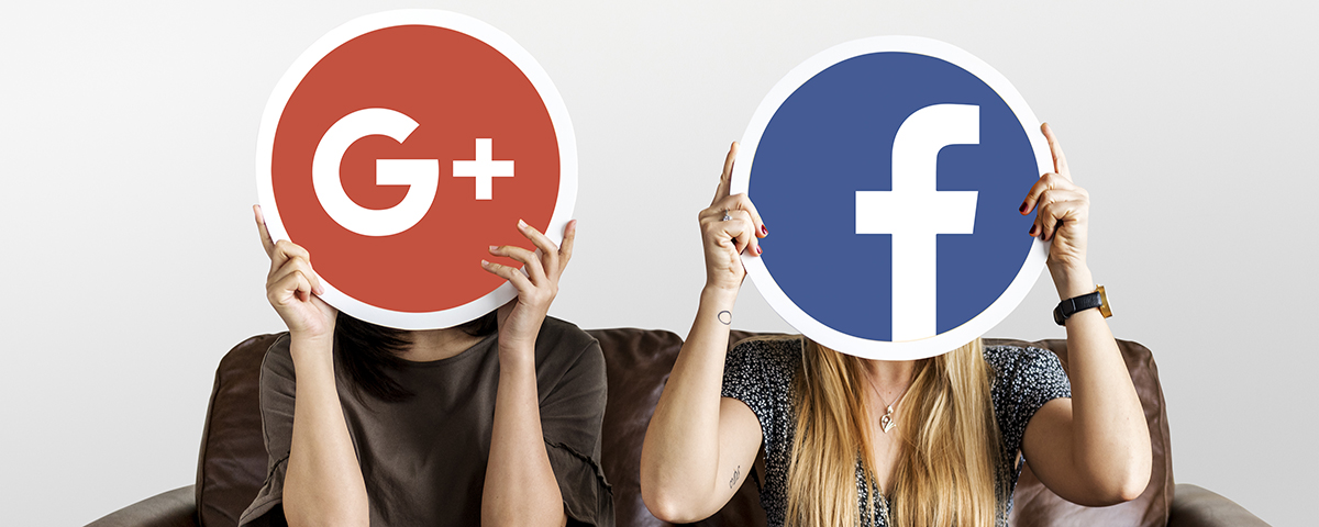 Women holding social media icons